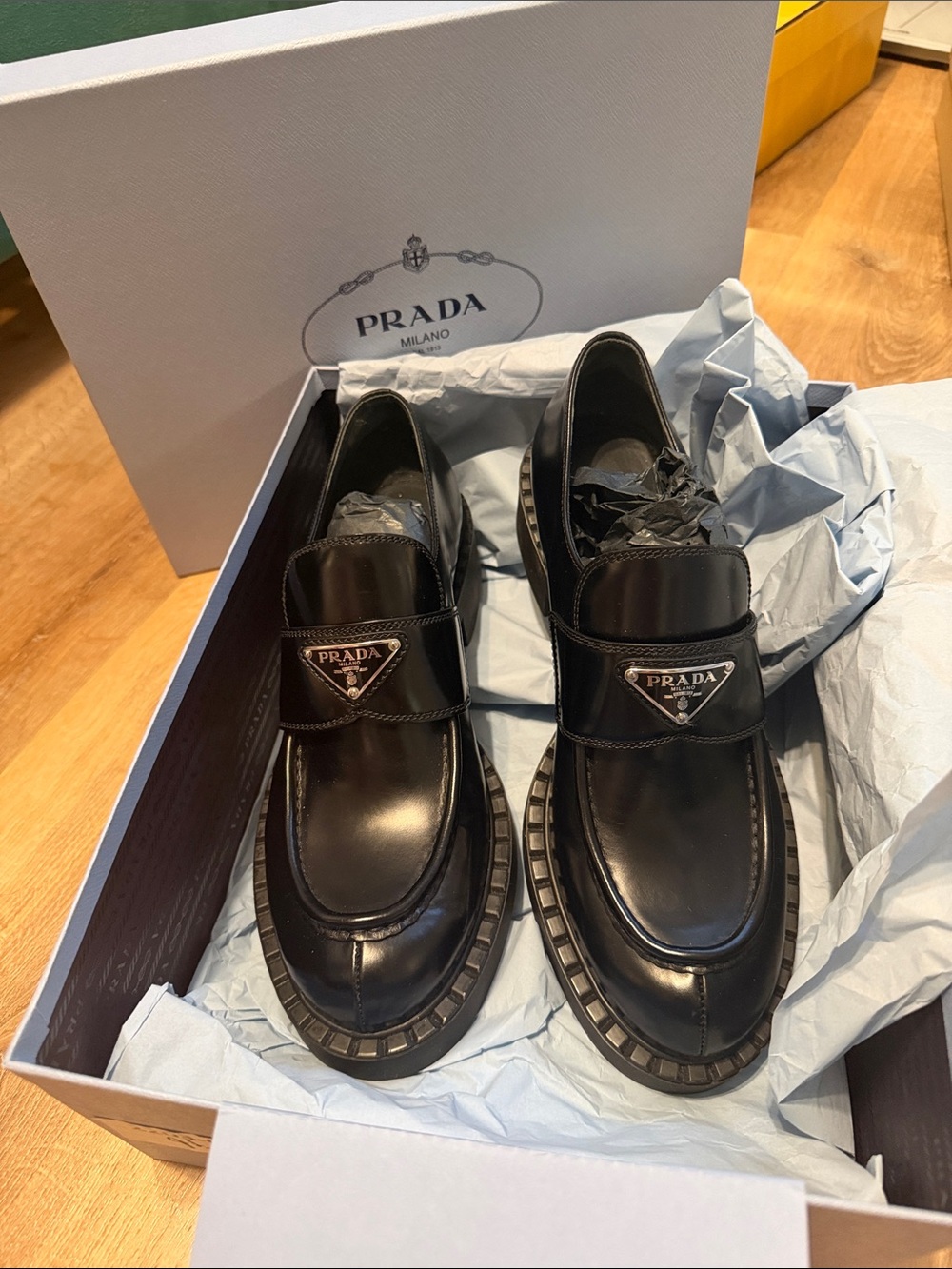 Prada Brushed Leather Women’s Slip-On Loafers with Silver Triangular Logo